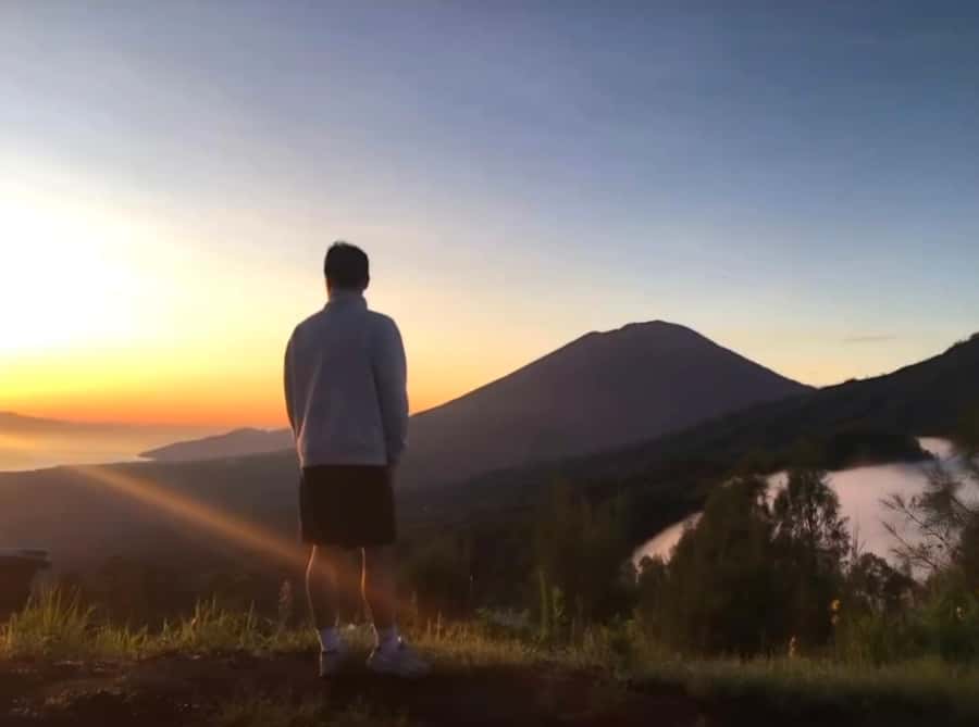 Bali: Caldera Sunrise Trek and Natural Hot Spring - Sunrise over four volcanic peaks