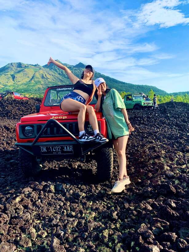 Bali: Sunset Mount Batur Jeep and Hot Spring All Inclusive - Black lava from the 1963 eruption