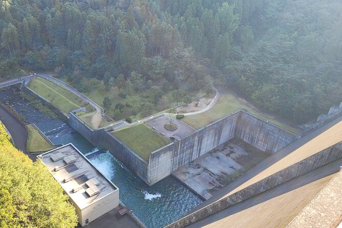 Deluxe Private Tour: Hita, AOT Statues and Onsen from Fukuoka - Oyama Dam brings the story outdoors