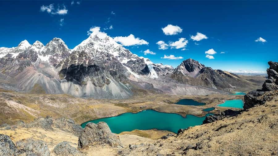 From Cusco: 7 Lagoons of Ausangate Trek with Hot Springs - Seven turquoise lagoons beneath Ausangate