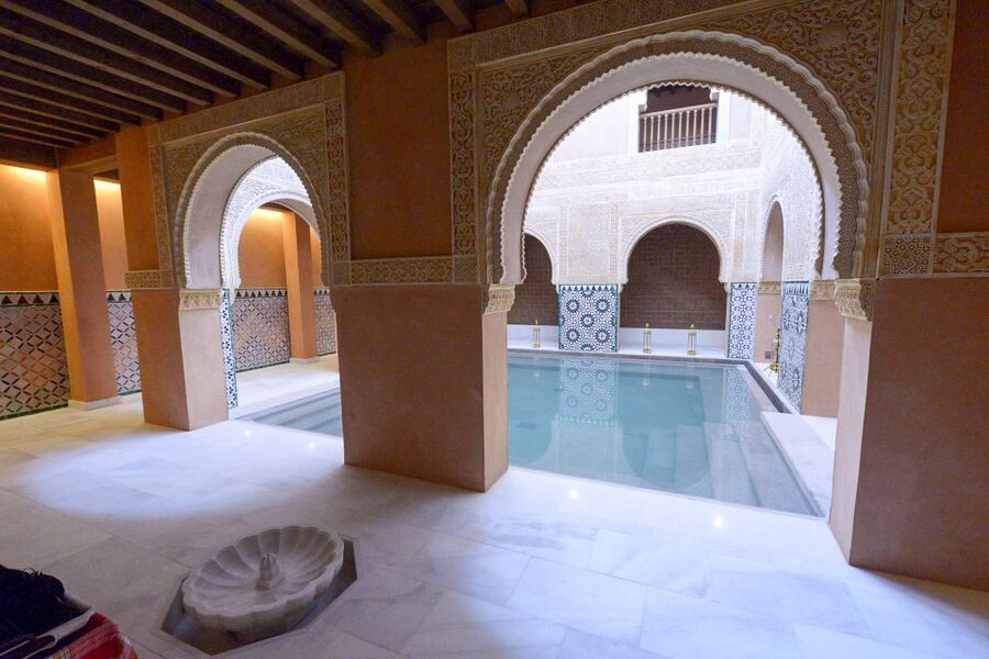 From Malaga: Hammam Bath, Kessa and Relaxing Massage Tour - The kessa scrub on the heated stone table
