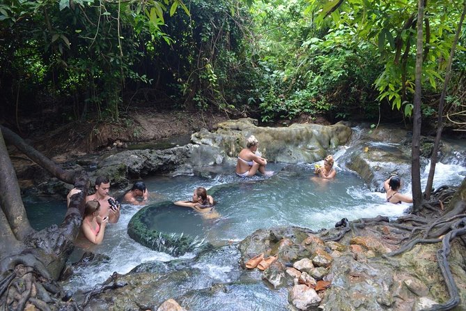 Full-Day Tour to Emerald Pool, Hot Springs & Tiger Cave Temple from Krabi - Namtok Ron Hot Spring Waterfall: warm water and a busy first stop