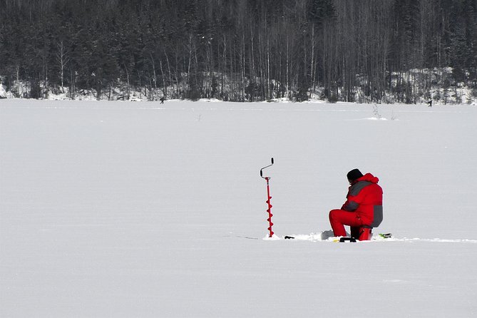 Lakeside Sauna Trip with Ice Fishing and Ice Swimming - Drilling through the ice